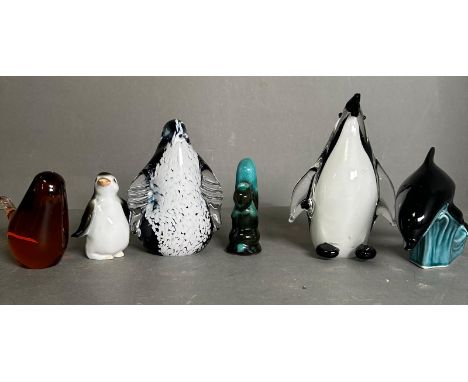 A selection of glass and ceramic animals to include a Poole pottery dolphin and a Wedgewood penguin 