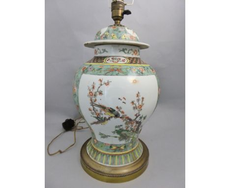 A C19th Chinese temple famille vert vase lamp with all over foliate, bird detailing with cartouches to lid and bulbous suppor