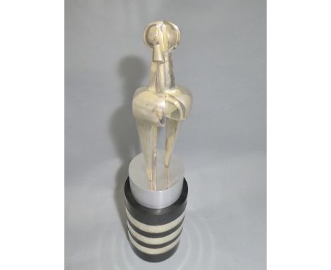 A modernist 800 silver sculpture, Amelio Raccamonte, 1927 - -Robot-, 1967, on brushed steel column, on black polished stone c