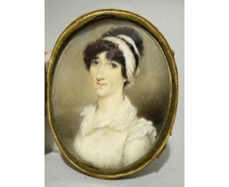 A C19th miniature oil on ivory / bone portrait of a Lady in original leather case.