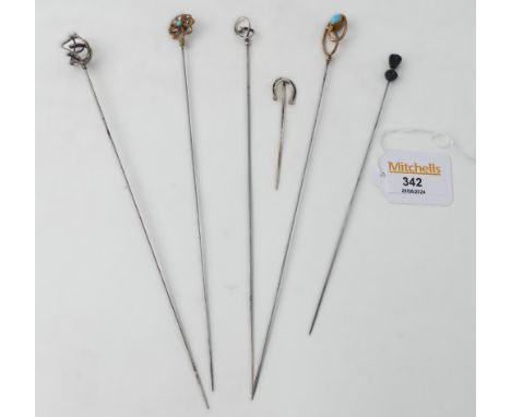 Six decorative hat pins, horseshoe, thistle and two silver topped ones marked CH etc