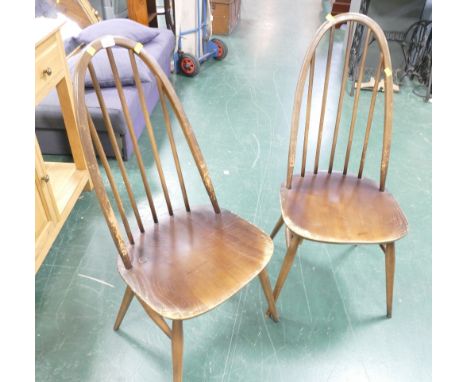 Pair of dark Ercol spindle back chairs 