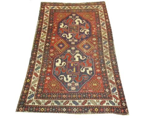 CHONDZORESK KARABAGH CARPET, 220cm x 145cm, Southern Caucasus, octagonal medallions enclosing snake like elements within corr