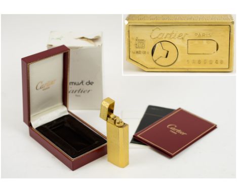 CARTIER LIGHTER, gold plated, unused, with original box. 