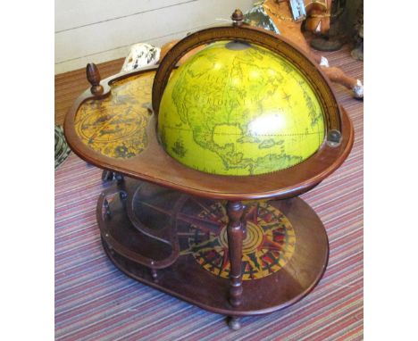 COCKTAIL CABINET, in the form of a globe on a stand with terrestrial, astrological and meteorological detail, 91cm x 67cm x 1