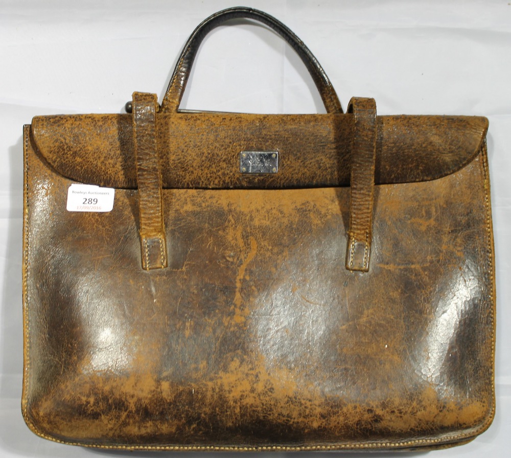 An early 20th century leather music case with exterior chrome plated