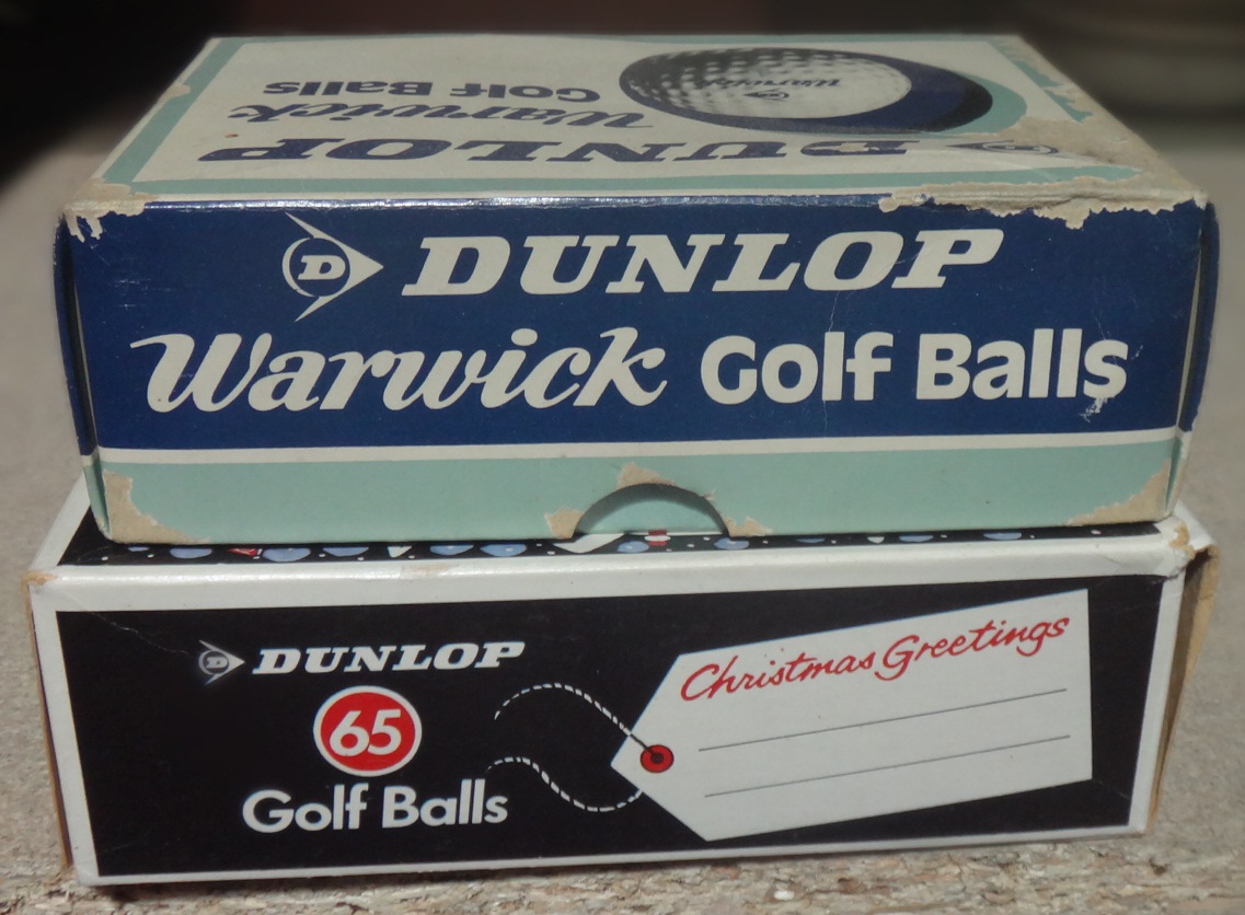 A box of six Dunlop Warwick golf balls and a box of six Dunlop 65 golf