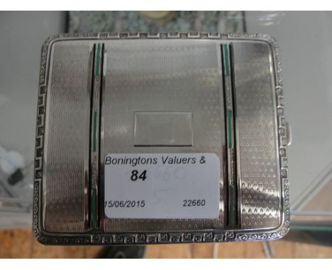 A Continental silver enamelled cigarette case with green and black enamels to engine turned case