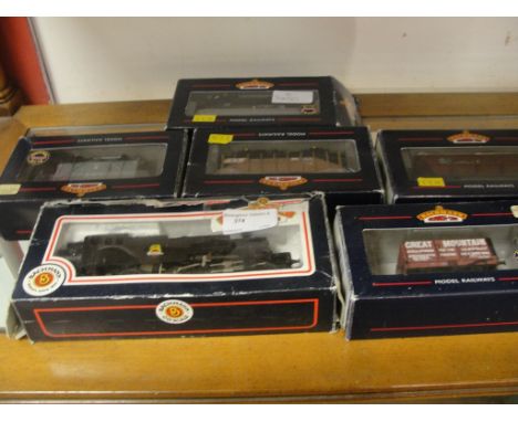 A boxed Bachmann locomotive; together with boxed rolling stock