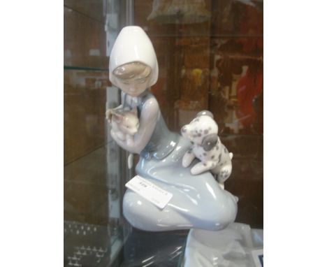 A Lladro figurine: a young girl with a cat and puppy