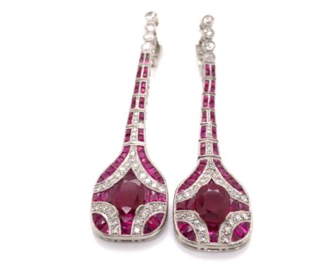 A PAIR OF ART DECO STYLE ARTICULATED DROP RUBY AND DIAMOND PENDANT EARRINGS. THE PRINCIPLE OVAL RUBY APPROX MEASUREMENT 6 x 8