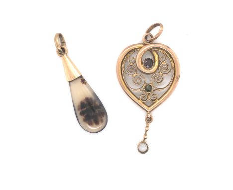 A VINTAGE ALMANDINE GARNET AND PERIDOT WIREWORK HEART PENDANT. UNHALLMARKED AND ASSESSED AS 9ct YELLOW GOLD. MEASUREMENTS EXC