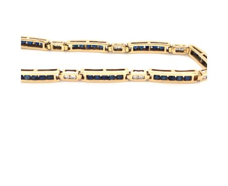 A SAPPHIRE AND DIAMOND PANEL LINE BRACELET. THE BRACELET SET WITH FORTY BRILLIANT CUT SAPPHIRES AND SIXTEEN BRILLIANT CUT DIA