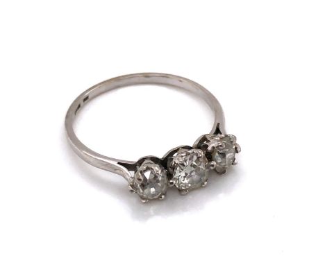 AN ANTIQUE PLATINUM AND THREE STONE OLD CUT DIAMOND RING. THE THREE GRADUATED OLD CUTS EACH IN A SIX CLAW SETTING. APPROX DIA