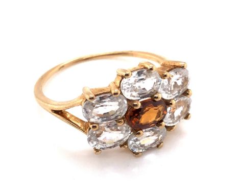 A MODERN 9ct HALLMARKED GOLD DRESS RING, THE SEVEN GEMSTONES IN A HORIZONTAL CLAW SETTING. FINGER SIZE S. WEIGHT 3.4grms. 