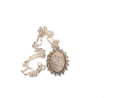 A VICTORIAN SILVER HALLMARKED OVAL PORTRAIT LOCKET DATED 1882 BIRMINGHAM, SUSPENDED ON A LATER SILVER ROPE CHAIN. LOCKET 4cms