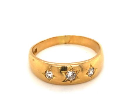 AN ANTIQUE THREE STONE OLD CUT DIAMOND GYPSY RING. THE SHANK STAMPED 18ct BH, AND ASSESSED AS 18ct GOLD. APPROX ESTIMATED TOT