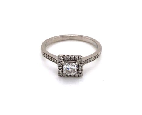 A PLATINUM AND DIAMOND PRINCESS CUT AND HALO SET RING WITH DIAMOND SET SHOULDERS. CENTRE PRINCESS CUT DIAMOND APPROX 0.40ct, 
