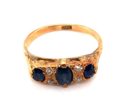 AN ANTIQUE SAPPHIRE AND DIAMOND CARVED HALF HOOP RING. THE SHANK STAMPED 18ct AND ASSESSED AS 18ct YELLOW GOLD. FINGER SIZE O