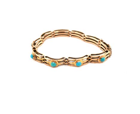A VINTAGE TURQUOISE SET OLD GOLD GATE STYLE BRACELET COMPLETE WITH SAFETY CHAIN. UNHALLMARKED WITH THE CLASP STAMPED 9ct, AND