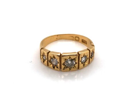 A VINTAGE 18ct YELLOW GOLD HALLMARKED FIVE STONE GRADUATED OLD CUT DIAMOND GYPSY RING. THE HALLMARKS RUBBED. FINGER SIZE L. W