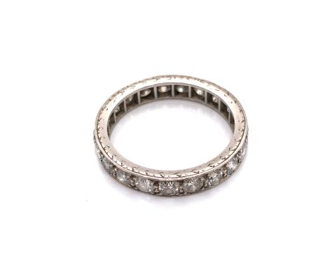 AN ANTIQUE DIAMOND FULL ETERNITY RING. UNHALLMARKED AND ASSESSED AS PLATINUM. THE ETERNITY BAND CONSISTING OF TWENTY-ONE DIAM