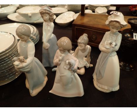 Five Nao figurines 