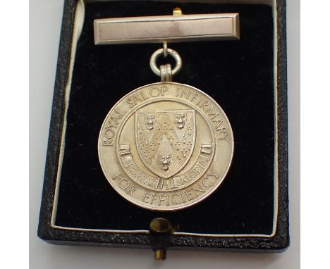 Hallmarked silver Royal Salop Infirmary Efficiency medal date 1954 with inscription