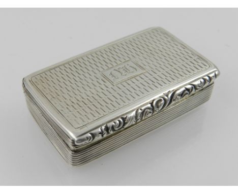 A Georgian solid silver snuff box, having engine turned design, hallmarked Birmingham 1829, bears makers mark Howard Smith. L