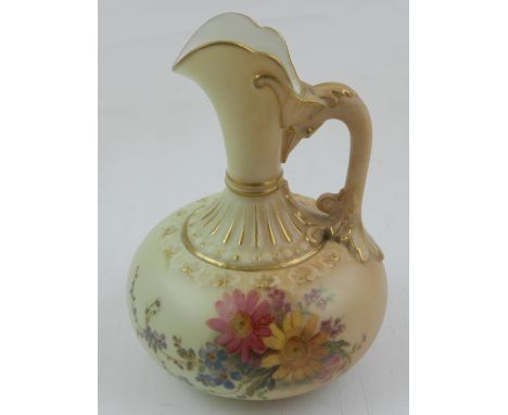 A Royal Worcester blush ivory porcelain baluster jug, with scrolling foliate handle, decorated with flowers and foliage. H. 1