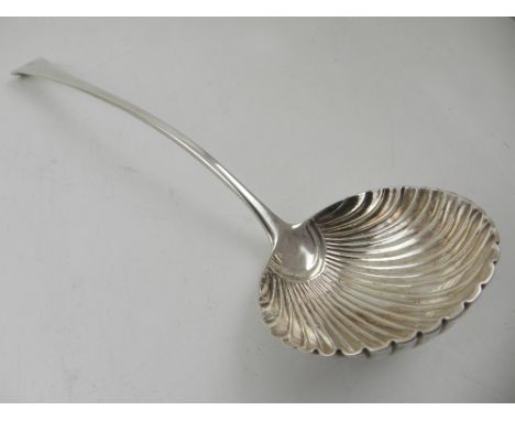 A Georgian silver ladle, with shell shaped bowl, hallmarked London 1802, L. 34cm 