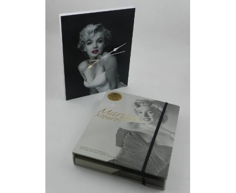A wall clock printed with image of Marilyn Monroe to dial,  together with a Marilyn Monroe book and DVD ' The Story of her Ic