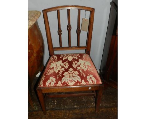 A pair of George III dining chairs, with stick backs and slip-in seats on square tapering legs, (2)