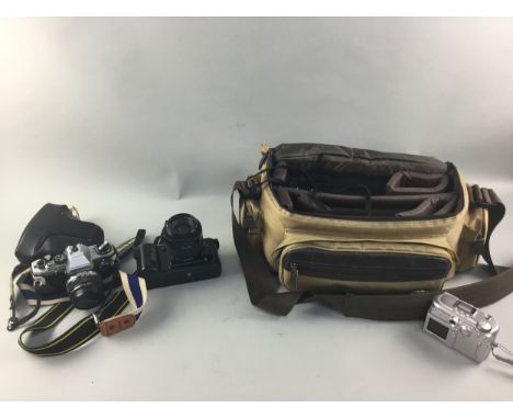 CAMERAS AND ACCESSORIES, comprising a Nikon F-401, an Olympus OM10, lenses, flash and other accessories, also a camera carry 