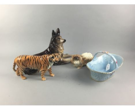 BESWICK FIGURE OF A TIGER, 30cm long, along with two ceramic dog figures and a Melba Ware pottery basket (4)