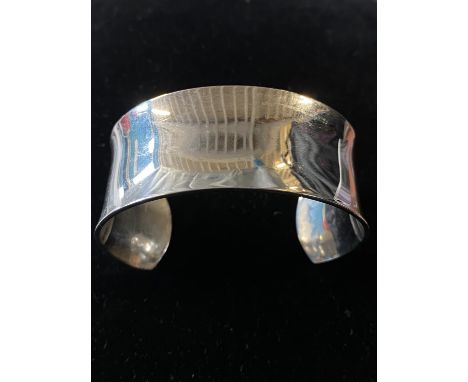 A stamped 925 silver torque bangle