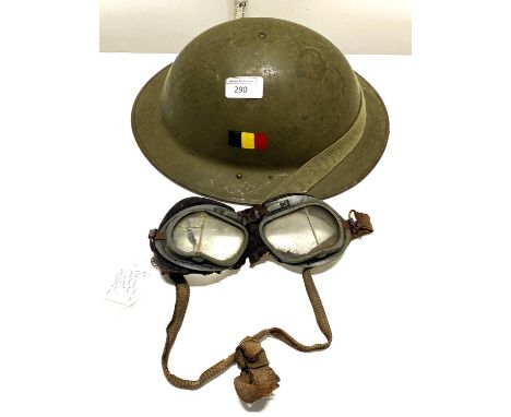 A WW2 military helmet and a pair of WW2 RAF MK VIII pilot goggles (in poor condition)