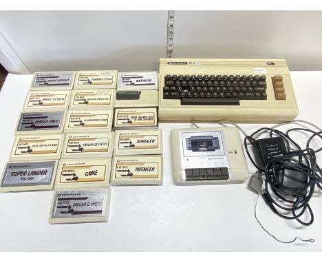 A Commodore VIC-20 computer console with accessories and large selection of gaming cassettes (untested)