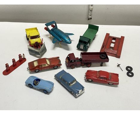 A box full of assorted play worn vintage die-cast models