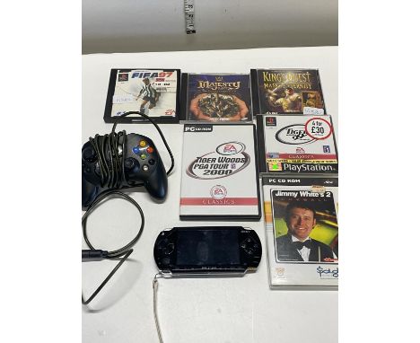 A Sony PSP (no Leads) and selection of assorted PC and Playstation games (untested)