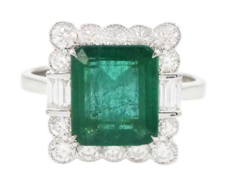 18ct white gold octagonal cut emerald, round brilliant cut and emerald cut diamond cluster ring, stamped 750, emerald 2.66 ca