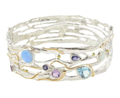 Silver and 14ct gold wire opal, topaz, amethyst and iolite hinged bangle, stamped 925Condition Report:Inner circumference = 2