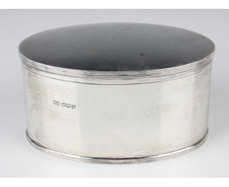 A George V silver oval tea caddy with hinged lid and reeded rims, Sheffield 1918 by Wilson &amp; Sharp Ltd, weight 431.2g, he