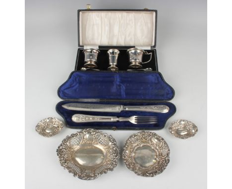 An Elizabeth II silver three-piece condiment set of tapering cylindrical form, comprising mustard, pepper caster and salt, Bi