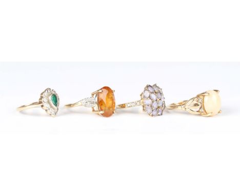 A 9ct gold ring, claw set with an oval opal, ring size approx N1/2, another 9ct gold ring, claw set with an oval cut citrine 
