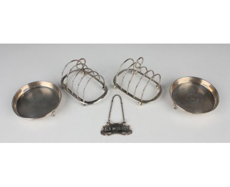 A pair of Edward VIII silver circular engine turned pin dishes, each centre engraved with '1917' above '1942', raised on scro