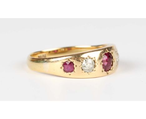A gold, ruby and diamond five stone ring, mounted with three cushion cut rubies alternating with two cushion cut diamonds, de