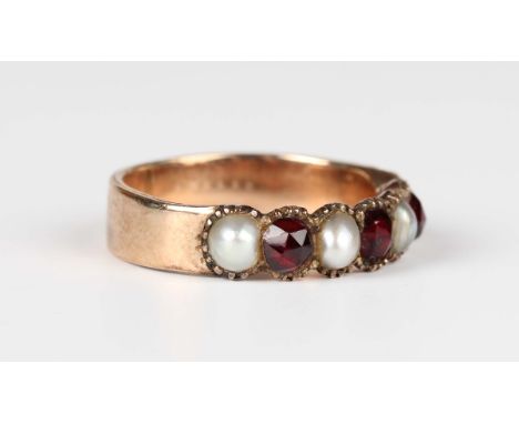 A gold, Bohemian garnet and half-pearl ring, mounted with three Bohemian garnets alternating with four half-pearls, unmarked,