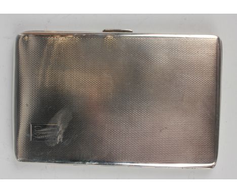 An Elizabeth II silver rectangular cigarette case with engine turned decoration, the interior engraved with an inscription 'T