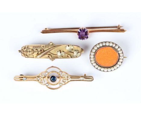 A gold brooch, decorated with a foliate spray, otherwise with applied bead and wirework decoration, detailed '15ct', weight 2